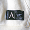 Angel City FC White Hoodie featuring color-blocked black and sol rosa ribbed hem and wrists.